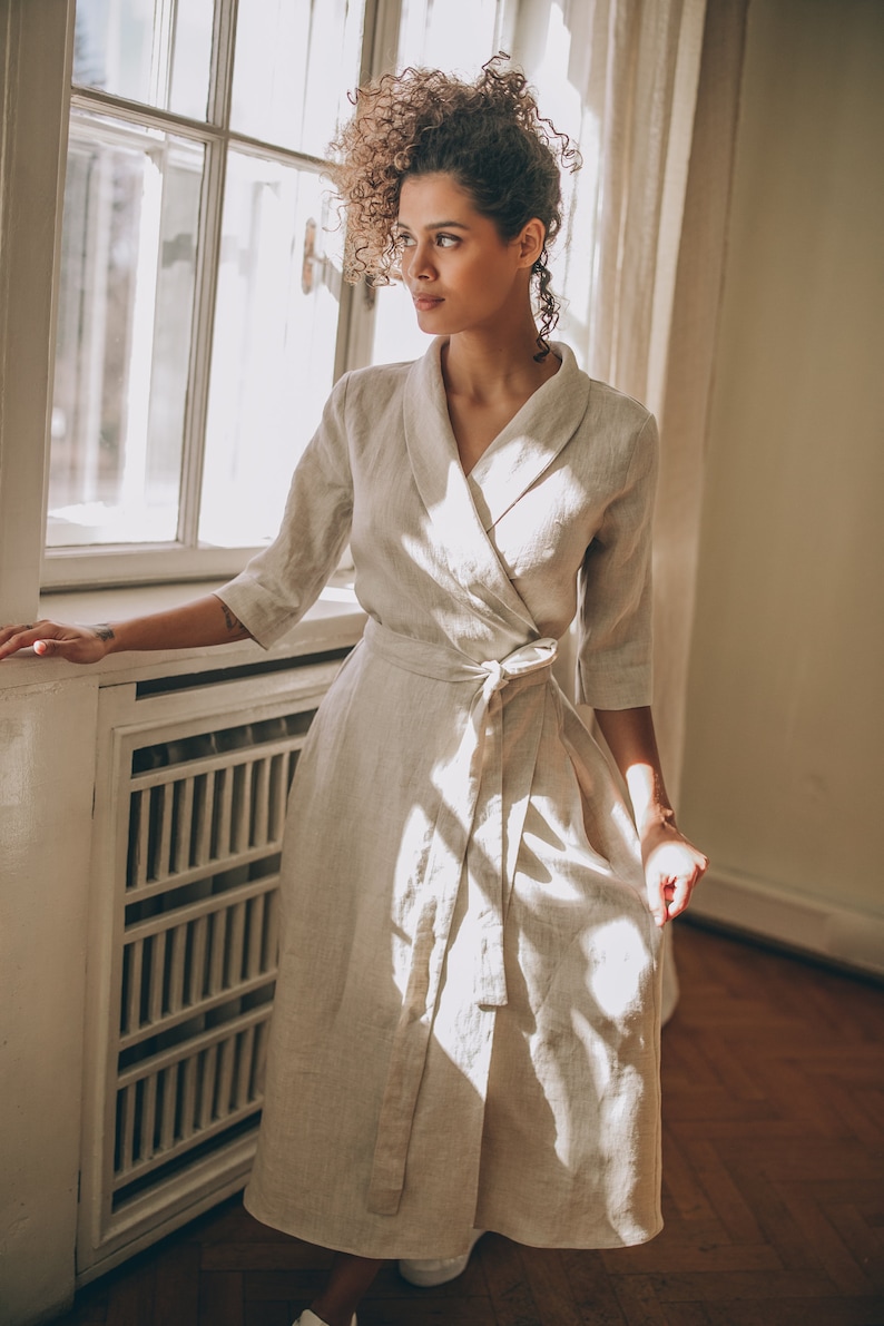 Timeless elegance in its most graceful form. We would like to present you this A-line wrap linen dress with an elegant tie waist and a V-neck collar. Made of 100% high quality linen