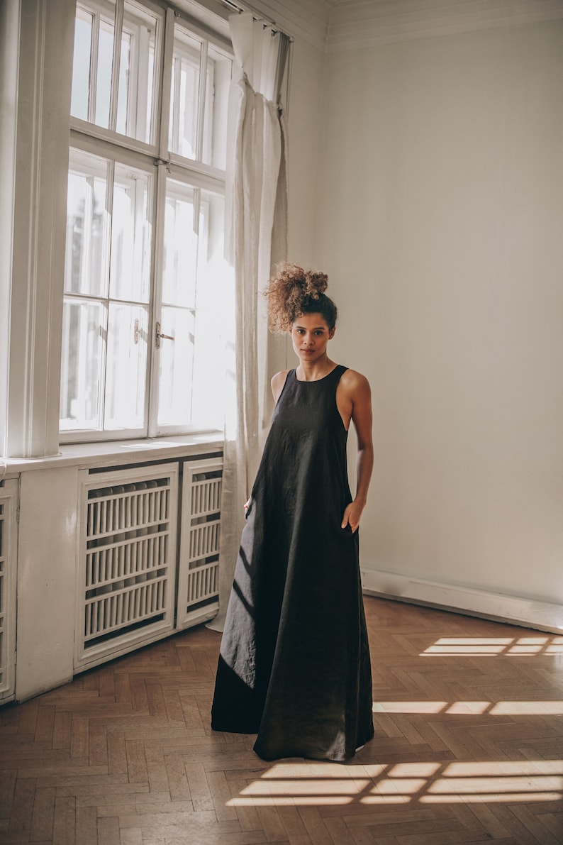 Long and soft, this maxi dress is made of organic linen that is breathable and pleasant to your body. The elongated cut and the pleat at the back create a beautiful silhouette that will turn heads everywhere you go.