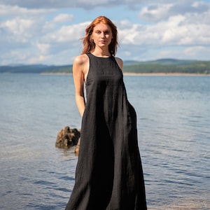 Sleeveless minimalist dress - perfect match for bold jewelry. Long and soft, this maxi dress is made of pure linen that is breathable and pleasant to your body. The elongated cut and halter back create a beautiful silhouette that will turn heads