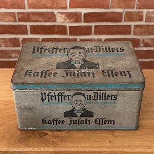 Scatola di latta antica della ditta Pfeiffer & Dillers, contenente essenza per aromatizzare il caffè, circa 1920/1930.