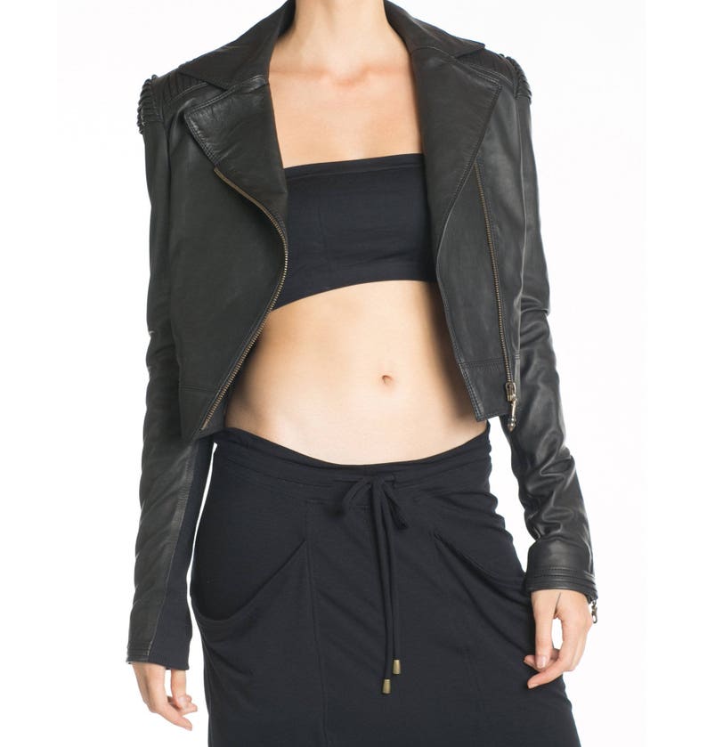 May include: A black leather jacket with a zipper closure and a cropped length. The jacket has a stand-up collar and a slightly fitted silhouette.