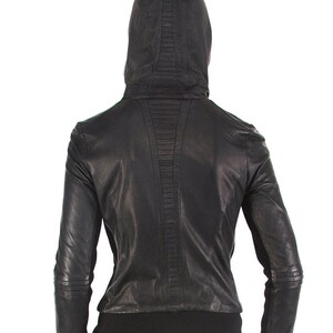 May include: Black leather jacket with a hood and a zipper closure. The jacket has a quilted design on the back.