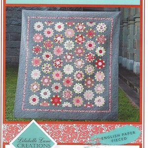May include: Quilt pattern for a quilt called "Tenderness" by Lilabelle Lane Creations. The quilt is made with English paper piecing and features a gray background with pink, red, and white flowers.