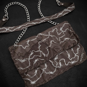 Bolso bandolera tipo clutch Jailbreak
