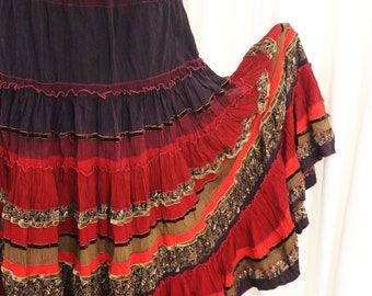 Spanish wine.Bright, picturesque, Long, tiered, red burgundy feminine skirt