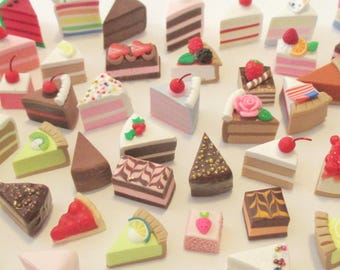 May include: A collection of miniature cake slices in various flavors and designs, including chocolate, fruit-topped, and layered varieties. Each tiny piece features detailed textures and colors, with some topped with cherries or sprinkles. Text reads MollysMiniStuff.