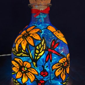 Large Patron bottle Lamp  Sunflowers, butterflies, hummingbird and lady bugs.