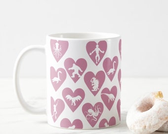 Cryptid Lover Mug featuring various cryptid silhouettes  in hearts - Mothman, Lake Monsters, Sea Monsters, Loveland Frogman cryptidcore mug