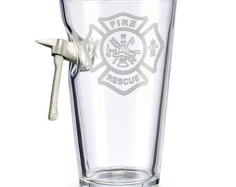 May include: A clear glass beer stein with a fireman's axe handle attached to the side. The glass has an etched design of a fire department logo with the words "FIRE RESCUE".