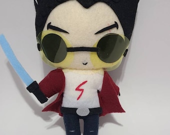 May include: A plush toy of a cartoon character with black hair, wearing a red jacket, white shirt with a red lightning bolt, blue jeans, and yellow sunglasses. The character is holding a blue lightsaber.