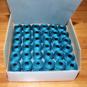 Prewound Bobbins style G size #69 nylon color teal blue 1 gross 144 pcs