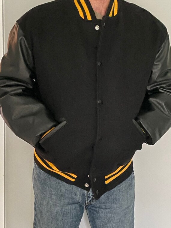 Black and yellow varsity jacket Gem