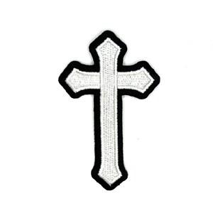 May include: Embroidered white cross patch with a black border. The cross has a detailed, textured design, and the edges are neatly finished. This patch is suitable for clothing or accessories.