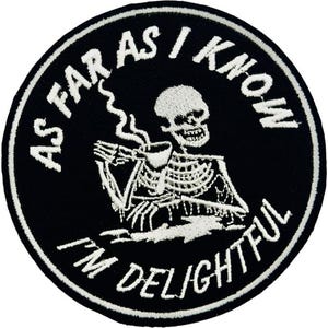 May include: Black and white embroidered patch with a circular design. The patch features a skeleton holding a cup of coffee, with the text "AS FAR AS I KNOW I'M DELIGHTFUL" in a circular pattern around the image. The patch has a white border.