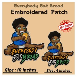 May include: Two embroidered iron-on patches featuring a cartoon character eating bread. The larger patch is 10 inches and the smaller patch is 4 inches. The text on the patches reads "Everybody Eat Bread".