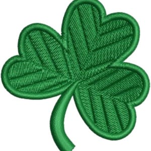 May include: A detailed, embroidered green shamrock patch. The three-leaf clover design features textured stitching and a rounded outline. Ideal for St. Patrick's Day crafts or adding a touch of Irish luck to apparel.