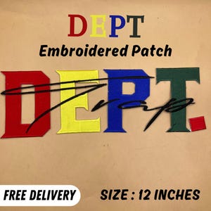 May include: Embroidered patch with the word "DEPT" in red, yellow, blue, and green. The patch is 12 inches in size and features a black cursive design overlaying the letters.