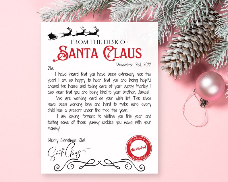 May include: A personalized letter from Santa Claus, featuring the text "FROM THE DESK OF SANTA CLAUS" in red. The letter is addressed to Ella and dated December 21st, 2022. The letter is decorated with a reindeer sleigh illustration.
