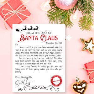 May include: A Christmas-themed letter from Santa Claus, featuring a red and white design with festive illustrations. The letter is addressed to "Ela" and includes a personalized message. The image is surrounded by Christmas decorations.