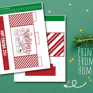 May include: Printable template for a North Pole Hot Chocolate stand. The design features red and white stripes, a Santa Claus logo, and the text "North Pole Santa Claus Hot Chocolate Co." and "Hot Cocoa 25&cent;".