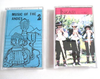 May include: Two vintage cassette tapes. One features a blue cover with the text "MUSIC OF THE ANDES" and an illustration of a musician and guitar. The other tape has a red border with the text "INKARI From Peru" and a photo of three musicians.