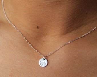 Om recycled sterling silver charm necklace. Handmade OM Symbol necklace. Sustainable and simple.