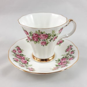 Image of Teacup filled with white meadowsweet flowers