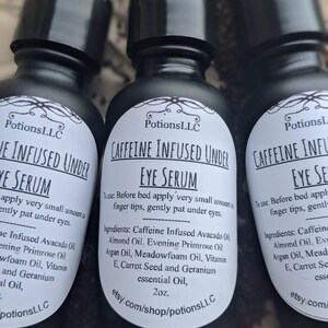 May include: Three black glass bottles with white labels containing caffeine infused under eye serum. The labels include the product name, ingredients, and instructions for use. The bottles are 2 ounces each and are available for purchase on Etsy.