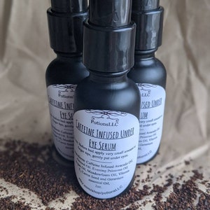 May include: Three black bottles of caffeine infused under eye serum with white labels. The label on the center bottle reads "Potions LLC Caffeine Infused Under Eye Serum 2 oz. Before bed apply very small amount to fingertips, gently pat under eyes. Ingredients: Caffeine Infused Avocado Oil, Almond Oil, Evening Primrose Oil, Meadowfoam Oil, Vitamin E Oil, Carrot Seed and Geranium essential Oil. etsy.com/shop/potionsLL.C"