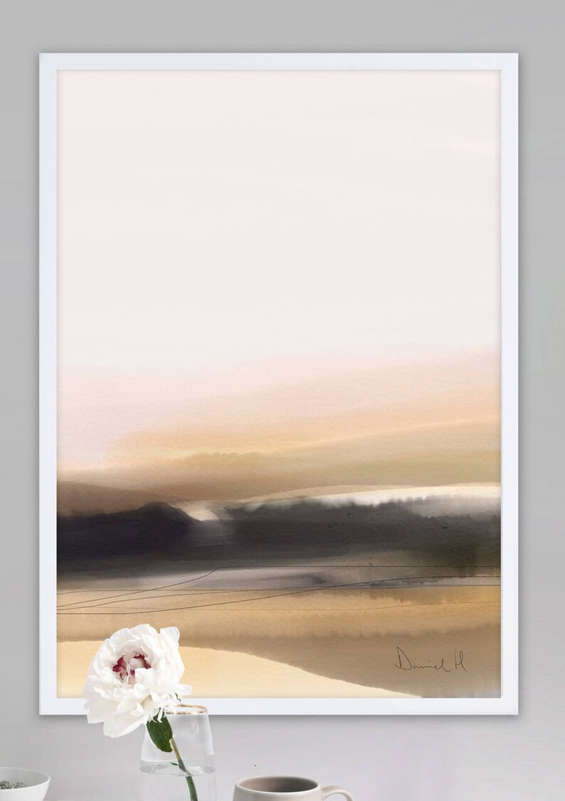 May include: Abstract landscape painting in a white frame. The painting features a soft, muted color palette of pink, beige, and brown. The artist's signature, "Daniel H", is visible in the bottom right corner.