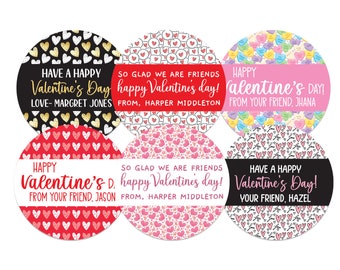 May include: A collection of six round Valentine's Day stickers. The stickers feature various patterns, including hearts and conversation hearts, with messages like "Happy Valentine's Day" and names. Colors include red, pink, black, and gold.
