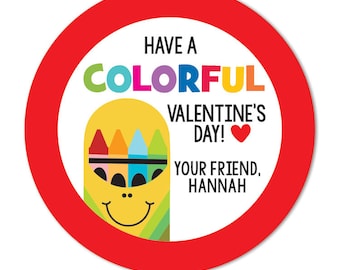 May include: A round sticker with a red border and a white interior. The text "HAVE A COLORFUL VALENTINE'S DAY!" is displayed in various colors. A smiling crayon character is featured, along with the text "YOUR FRIEND, HANNAH."