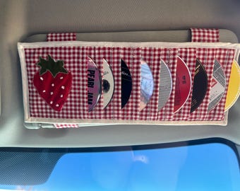 Soporte para CD en la visera del coche