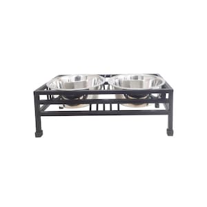 May include: Black metal elevated dog bowl stand with two stainless steel bowls.