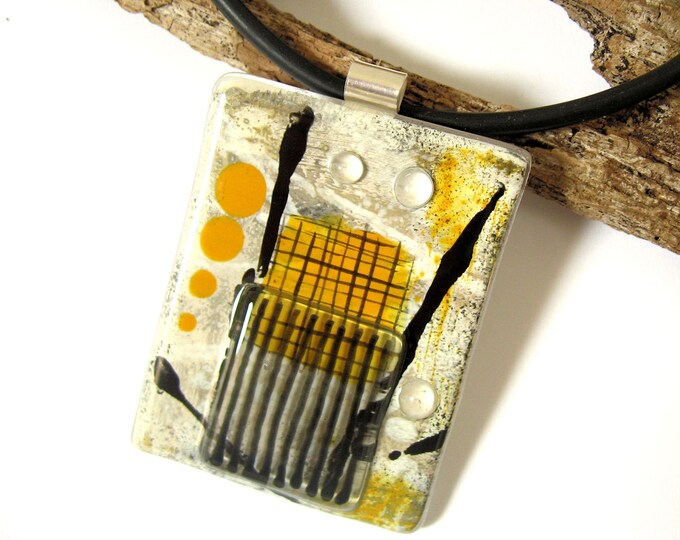 Textured glass pendant necklace with rubber cord and silver fastenings