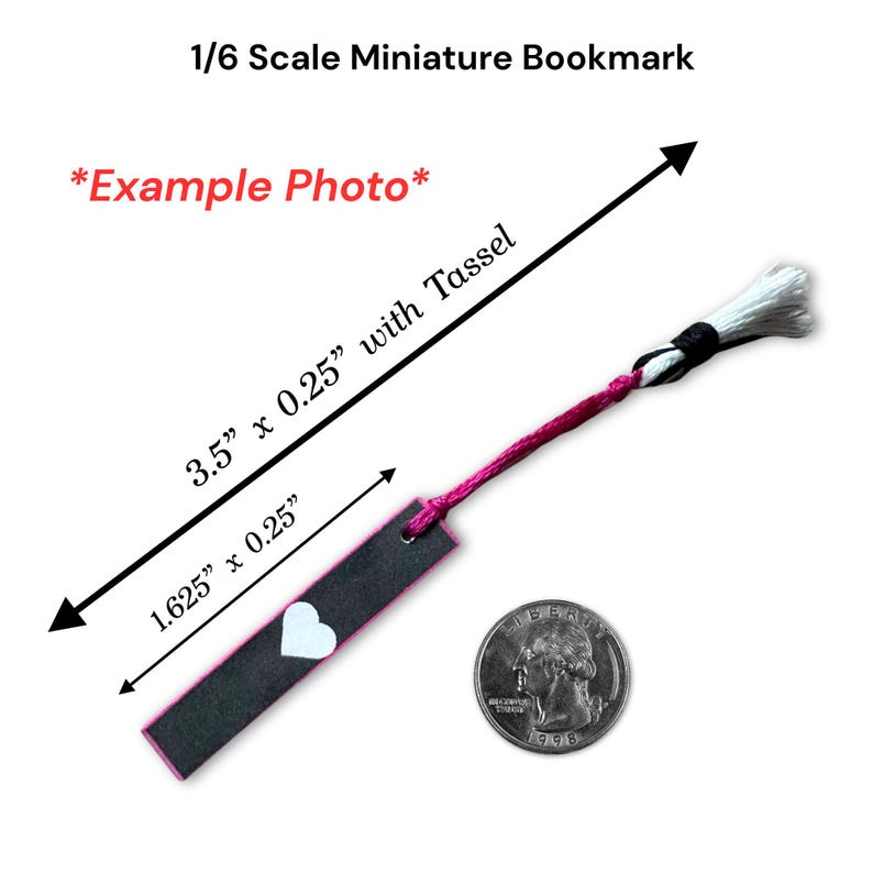 May include: A miniature bookmark, 3.5" long with a tassel, is shown next to a quarter for scale. The bookmark is black with a pink border and a white heart. The text "1/6 Scale Miniature Bookmark" and "*Example Photo*" are visible.
