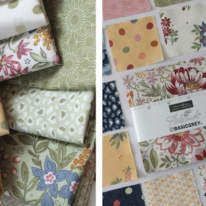 May include: A collection of fabric squares featuring various patterns including floral prints, polka dots, and geometric designs in shades of green, yellow, pink, and navy. A white paper band labeled Moda Fabrics Fieldrush BasicGrey wraps around the center.