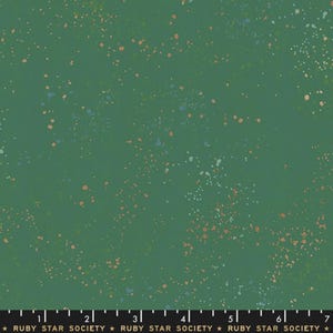 May include: Green fabric with a speckled pattern in shades of peach, blue, and white. The fabric has a dark green background and is from the Ruby Star Society.