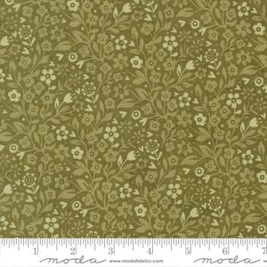May include: A fabric swatch featuring an olive green background with a dense, repeating pattern of small, light cream-colored flowers and leafy vines. A white ruler at the bottom shows measurements in inches, ranging from 0 to 7 inches.