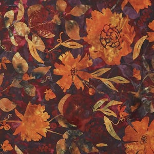 May include: A fabric with a floral pattern in shades of orange, yellow, and brown against a deep burgundy background. The design features large, stylized flowers, leaves, and fruit-like shapes, creating a rich, textured appearance.