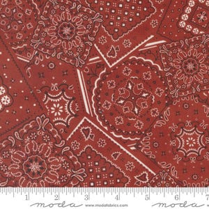 May include: Red fabric with a repeating pattern of white and black bandana designs. The fabric is 7 inches wide and features the text "moda" on the bottom.