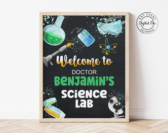 May include: A chalkboard sign with a black background and white chalk writing. The sign says "Welcome to Doctor Benjamin's Science Lab". The sign is decorated with images of beakers, test tubes, goggles, and a microscope.