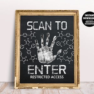 May include: A framed chalkboard-style print with gold trim. The black background features white text that reads "SCAN TO ENTER RESTRICTED ACCESS" with a handprint and chemical structures.