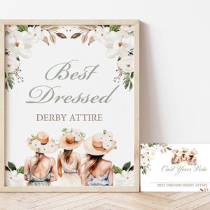 May include: A sign with white flowers and the text "Best Dressed Derby Attire". Below the text are three women wearing hats and dresses. A smaller sign below says "Cast Your Vote Best Dressed Derby Attire".