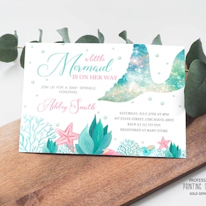 May include: A rectangular invitation with a mermaid theme. The text reads "a little Mermaid is on her way" in teal script. The invitation includes a mermaid tail design, coral, and a starfish. The event details are also included.