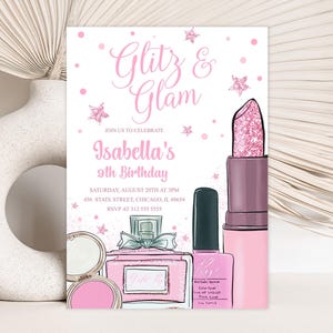 May include: Pink and white birthday invitation with the text "Glitz & Glam" and "Isabella's 9th Birthday". The invitation features illustrations of makeup products, including lipstick, nail polish, and perfume.