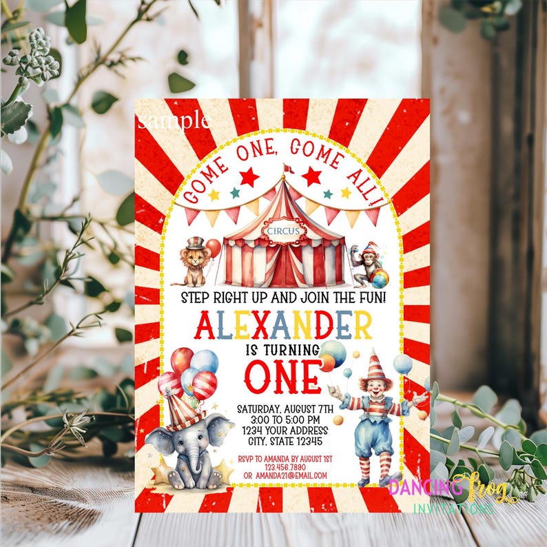 May include: A red and white circus-themed invitation for a first birthday party. The invitation features a colorful tent, a clown juggling balls, an elephant, a lion, and a monkey. The text on the invitation reads "Come one, come all!" and "Step right up and join the fun!" The invitation is for Alexander's first birthday party. The party is on Saturday, August 7th from 3:00 to 5:00 PM. The address is 1234 Your Address, City, State 12345. RSVP to Amanda by August 1st at 123.456.7890 or Amanda21@email.com.