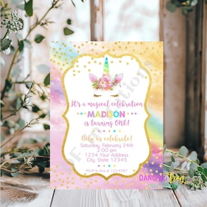 May include: A pink and blue unicorn birthday invitation with gold glitter stars and the text "It's a magical celebration... MADISON... is turning ONE!"  Help us celebrate! Saturday, February 24th 2:00 pm 1234 Your Address City, State 12345 RSVP to Ava at 123.4567