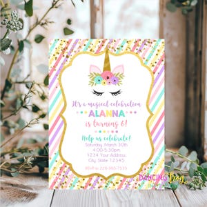 May include: A pink, purple, and blue striped invitation with gold stars and glitter. The invitation features a unicorn with a gold horn and a floral crown. The text reads "It's a magical celebration... Alanna is turning 6! Help us celebrate! Saturday, March 30th 4:00-5:30pm 1234 Your Address City, State 12345 RSVP to 228-365-7535 Dancing Frog Invitations".