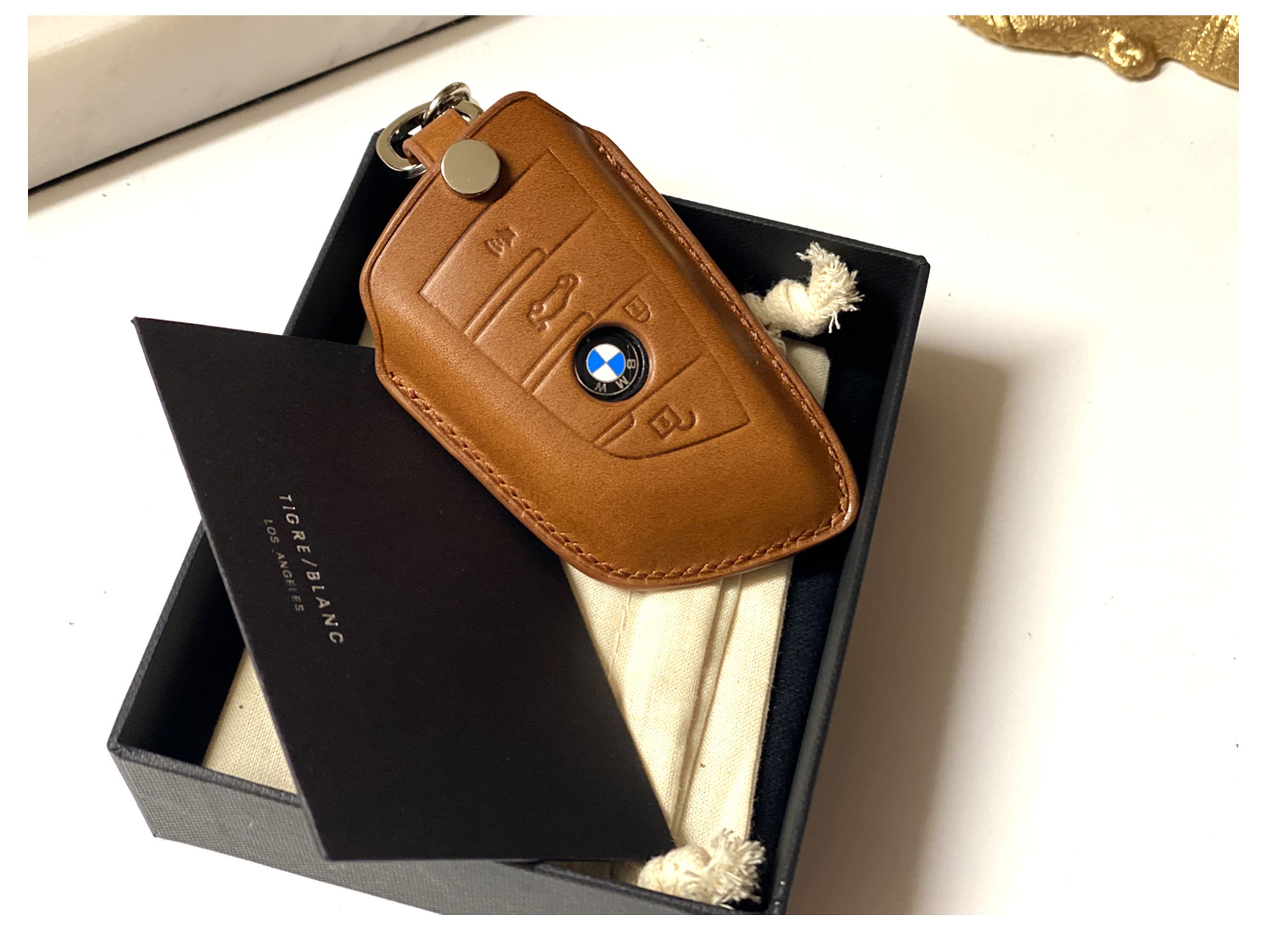 My old keychain was on its last legs so I remade it with BMW leather : r/BMW
